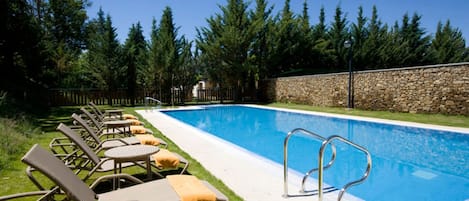 Seasonal outdoor pool, open noon to 8:00 PM, pool umbrellas