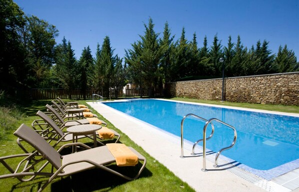 Seasonal outdoor pool, open noon to 8:00 PM, pool umbrellas