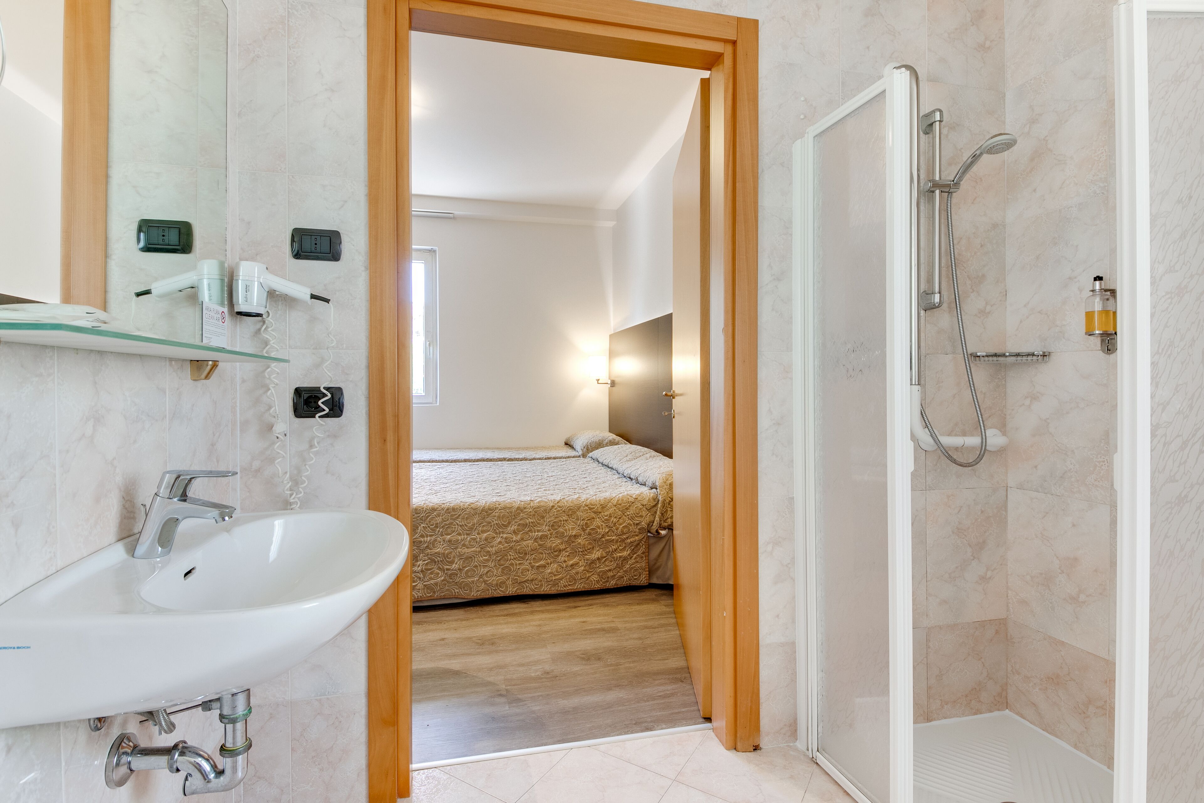 standard quadruple room | bathroom | shower, rainfall showerhead, hair dryer, slippers