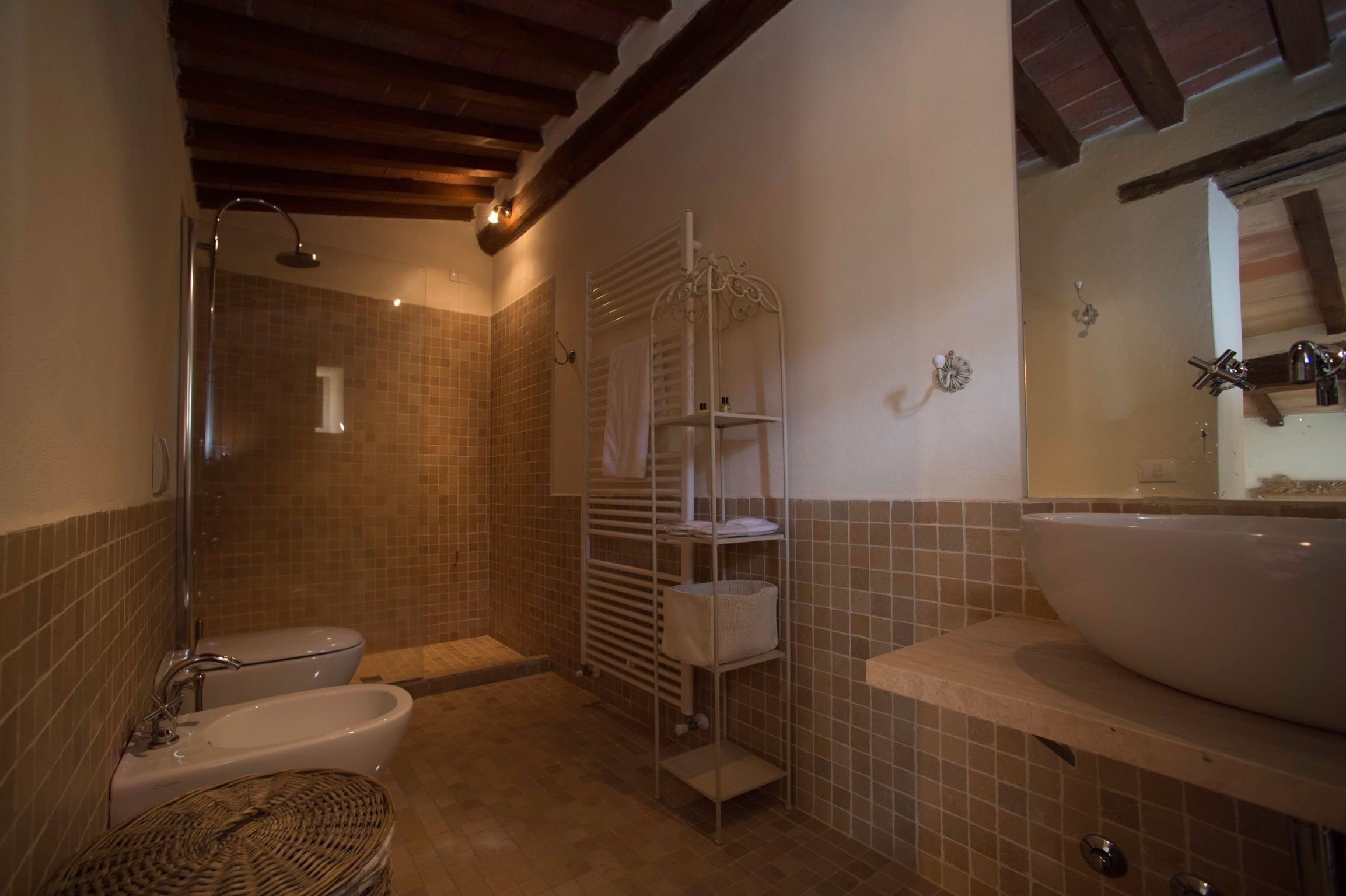 A bathroom with a bathtub, a sink, and a shower.