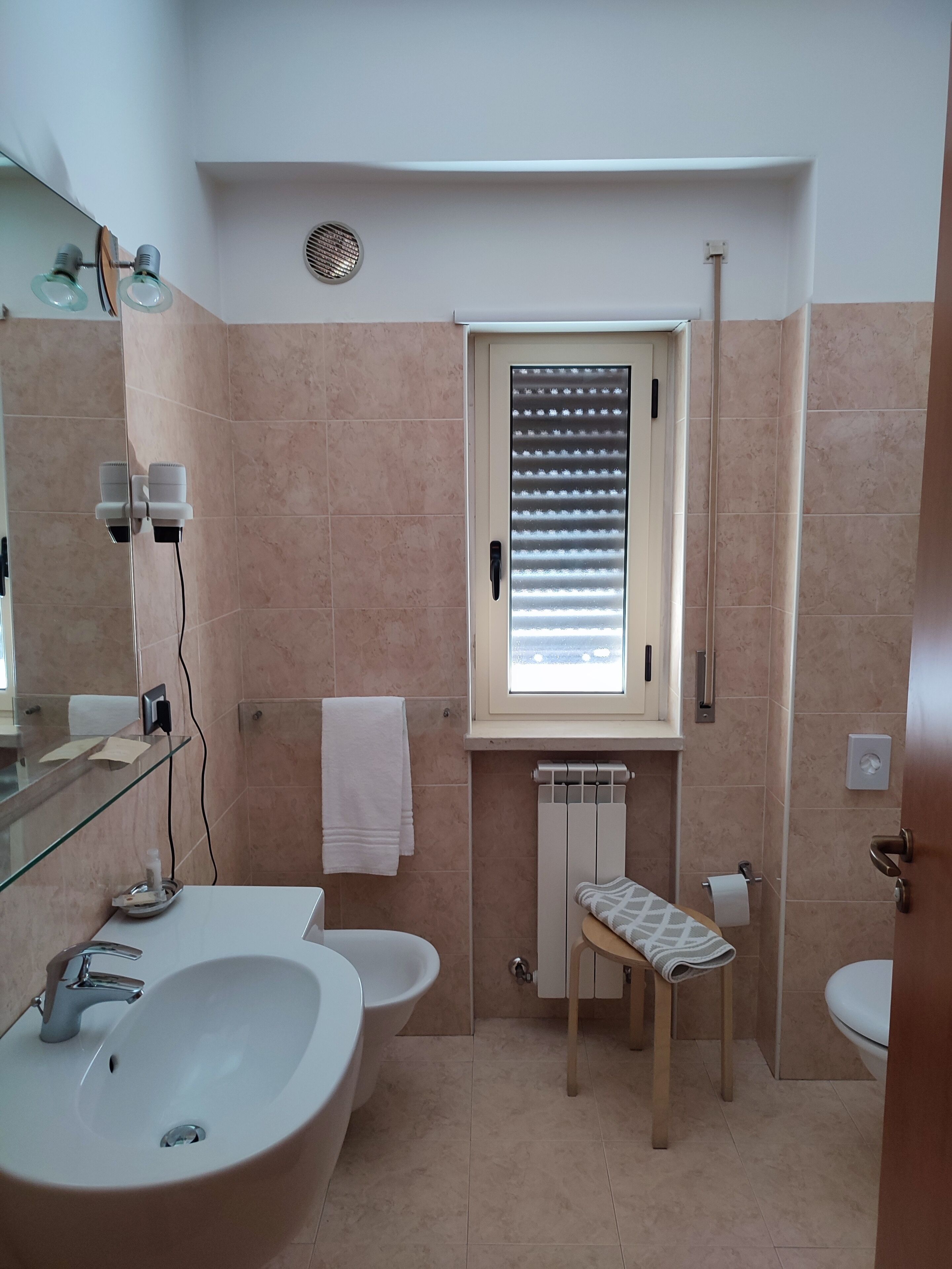 junior suite | bathroom | hair dryer, bidet, towels