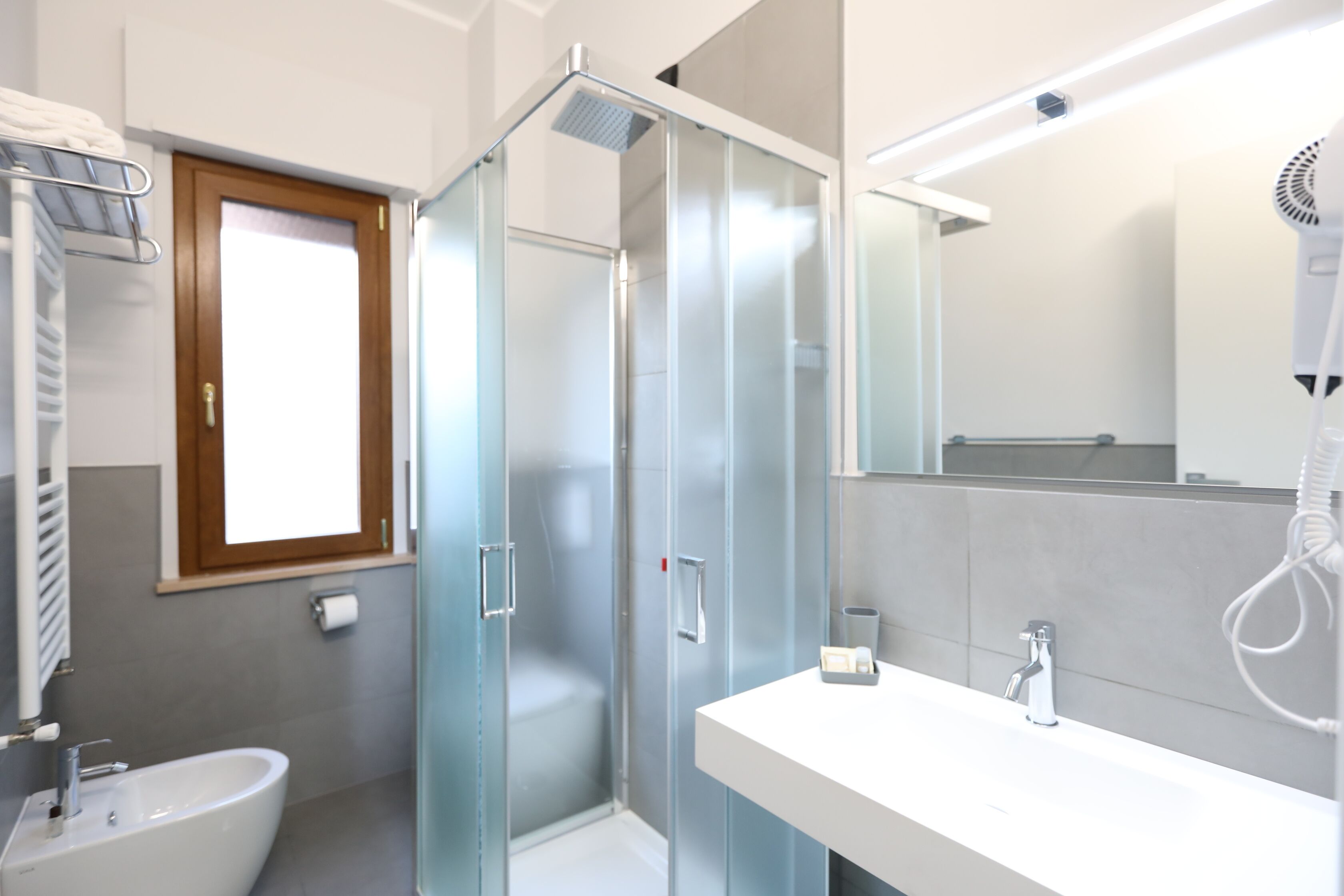 family suite | bathroom | hair dryer, bidet, towels