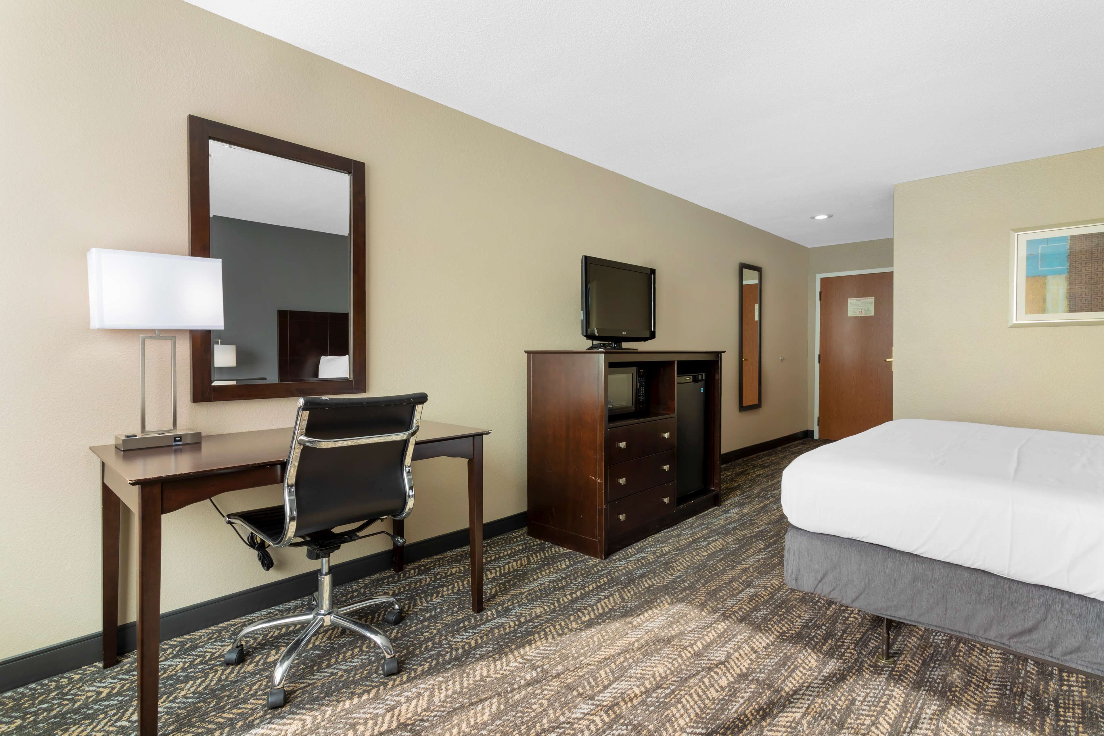 premium bedding, desk, laptop workspace, blackout curtains