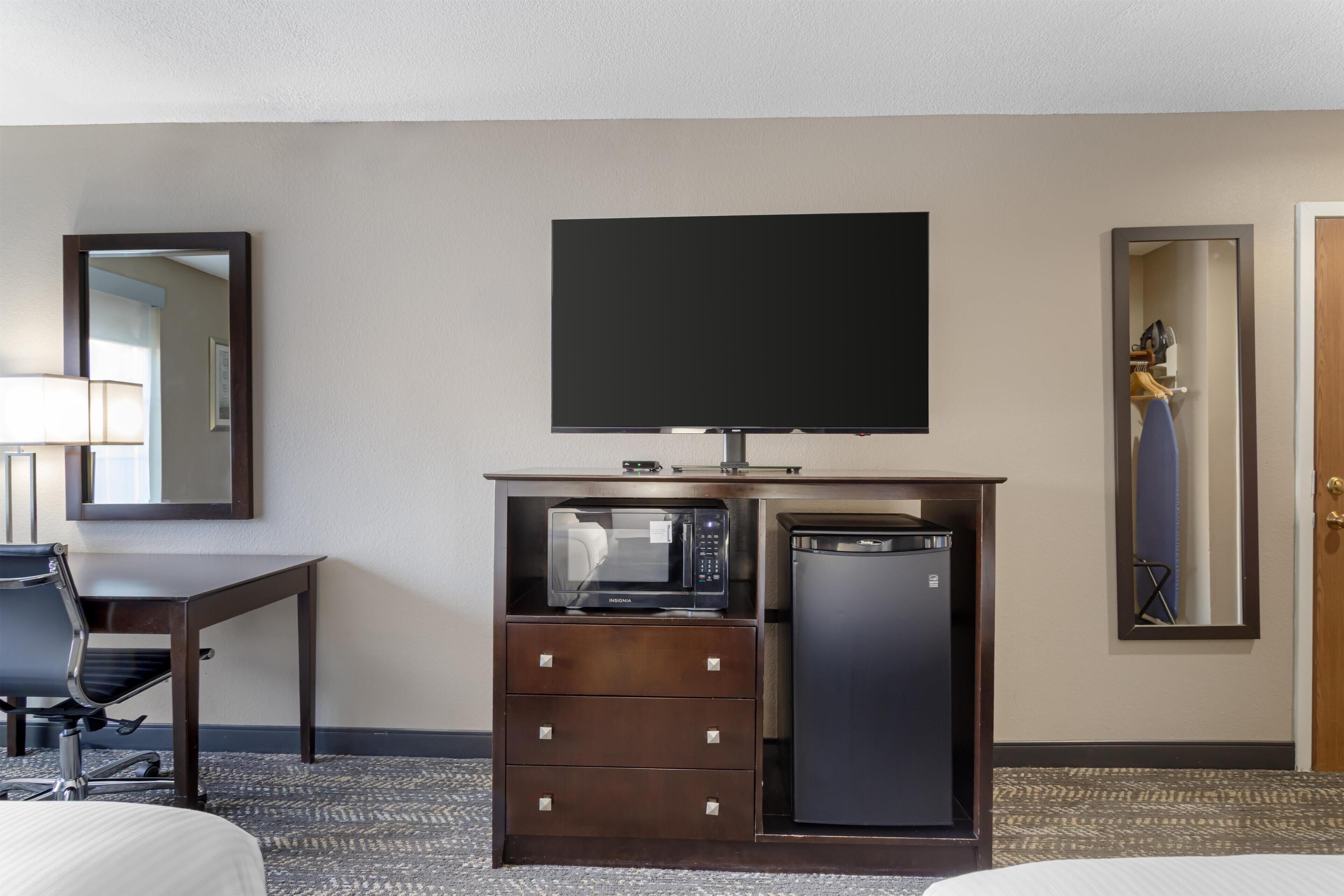 Premium bedding, desk, laptop workspace, blackout curtains