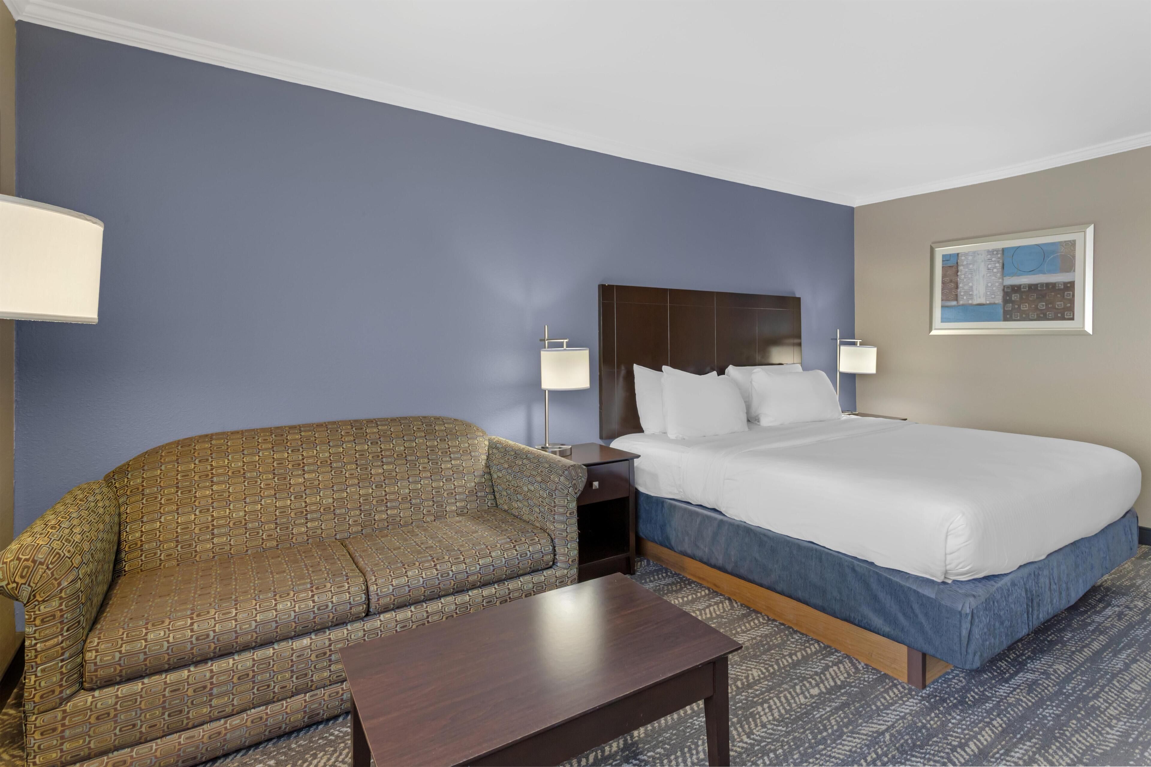 Premium bedding, desk, laptop workspace, blackout curtains