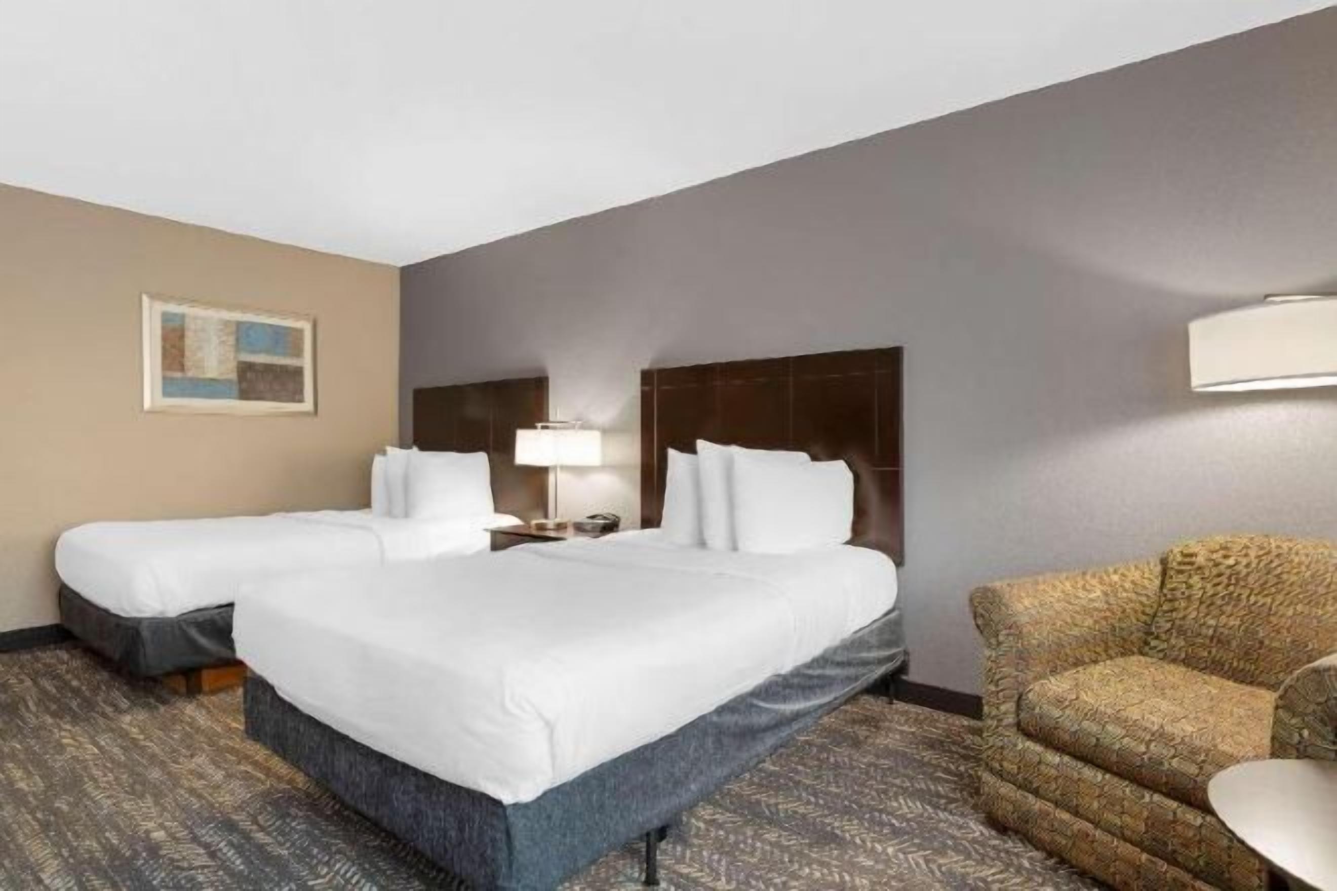 Premium bedding, desk, laptop workspace, blackout curtains