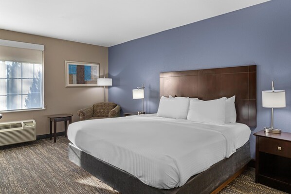 Premium bedding, desk, laptop workspace, blackout curtains