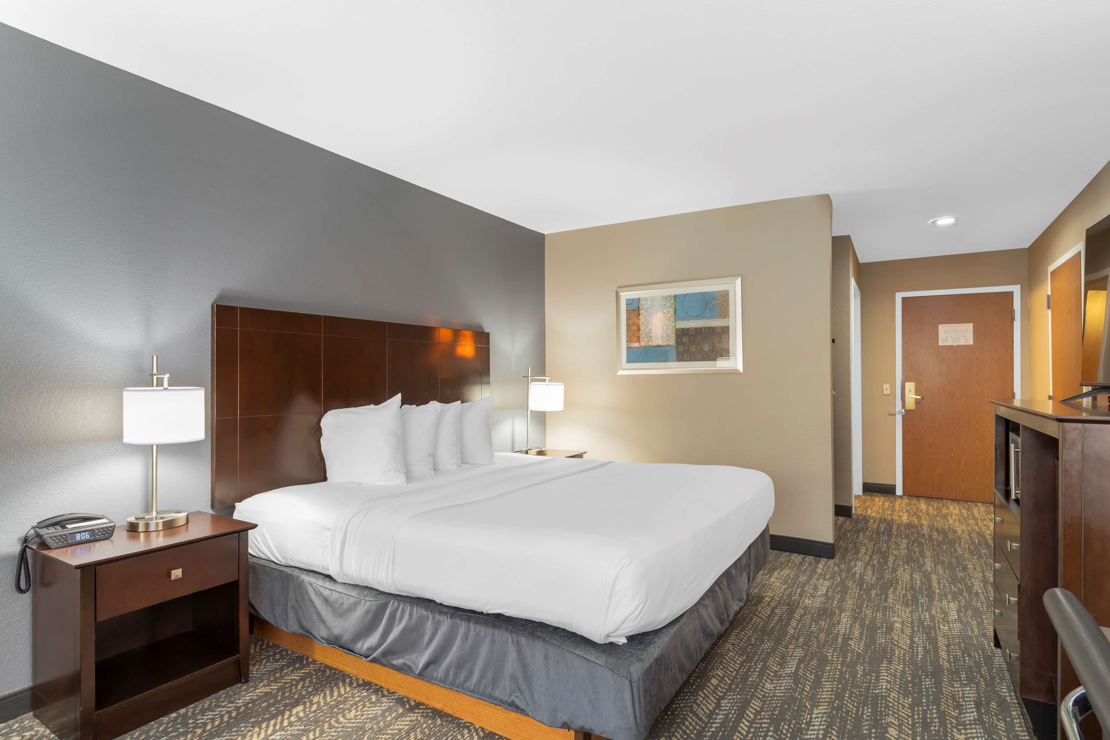 premium bedding, desk, laptop workspace, blackout curtains