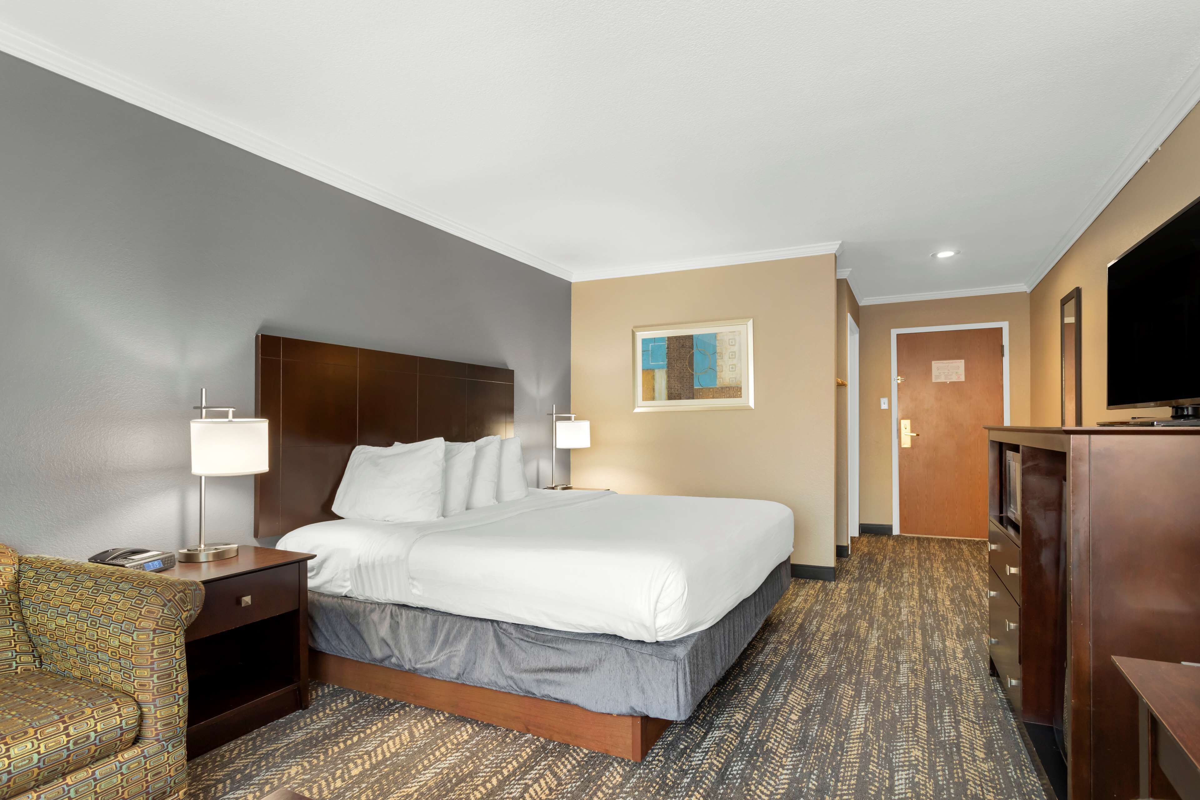 executive room, 1 king bed, non smoking, refrigerator & microwave (oversized room) | premium bedding, desk, laptop workspace, blackout curtains