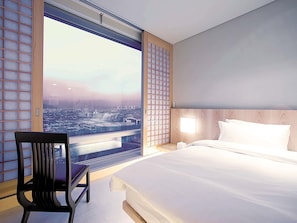 Deluxe Room, 1 King Bed | Premium bedding, minibar, in-room safe, individually decorated