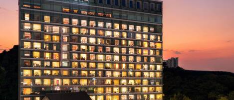 A multi-story hotel with a prominent 'Grand Mercure' sign at the top.