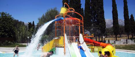 A water park with multiple slides and water features.