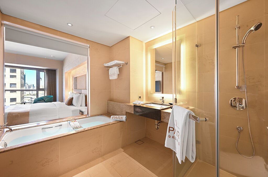 deluxe king room | bathroom | separate bathtub and shower, deep-soaking bathtub, free toiletries
