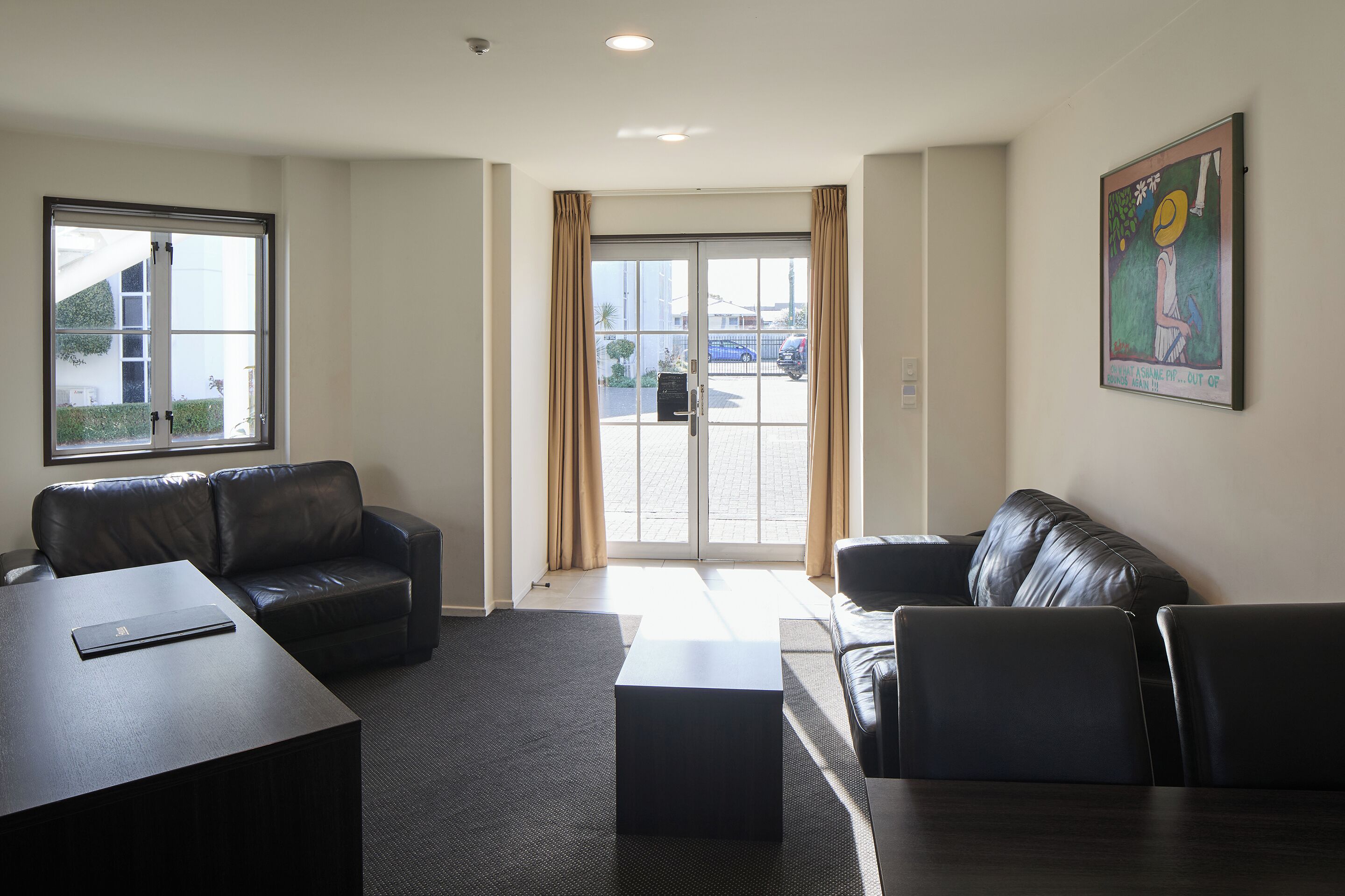 deluxe 2 bedroom apartment | living area | 43-inch smart tv with satellite channels, tv