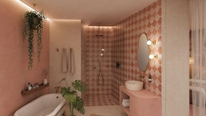 A bathroom with a vintage bathtub, a sink, a mirror, and a shower. - Van Der Valk Hotel Dennenhof (Brasschaat)