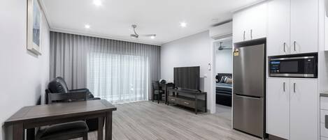One Bedroom Apartment | Living area | 40-inch Smart TV with satellite channels