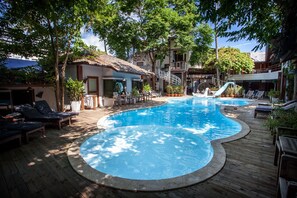 Outdoor pool, open 7:00 AM to 6:00 PM, pool umbrellas