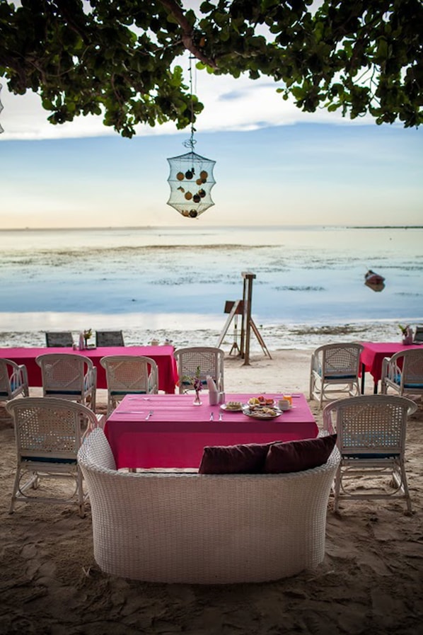 On the beach, white sand, beach umbrellas, beach towels