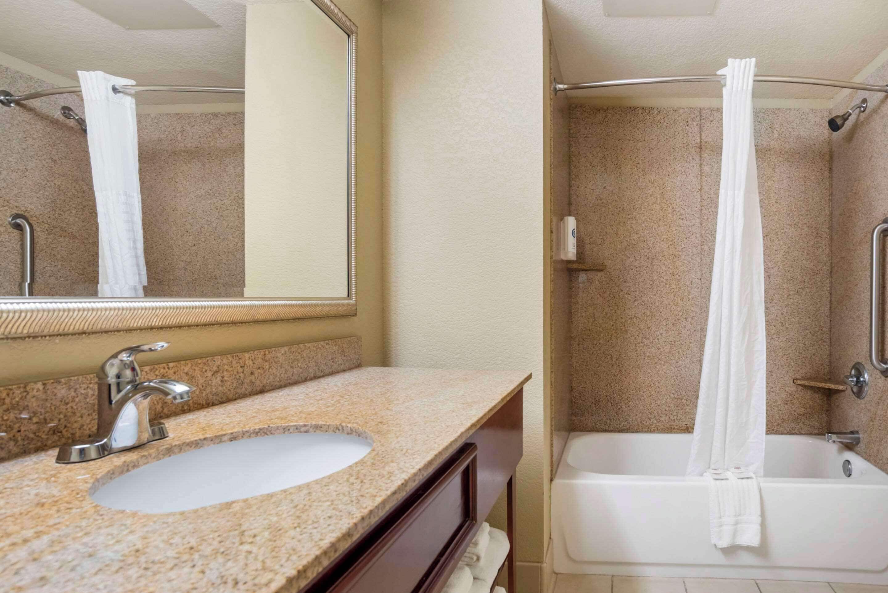 desk, laptop workspace, iron/ironing board, travel cot