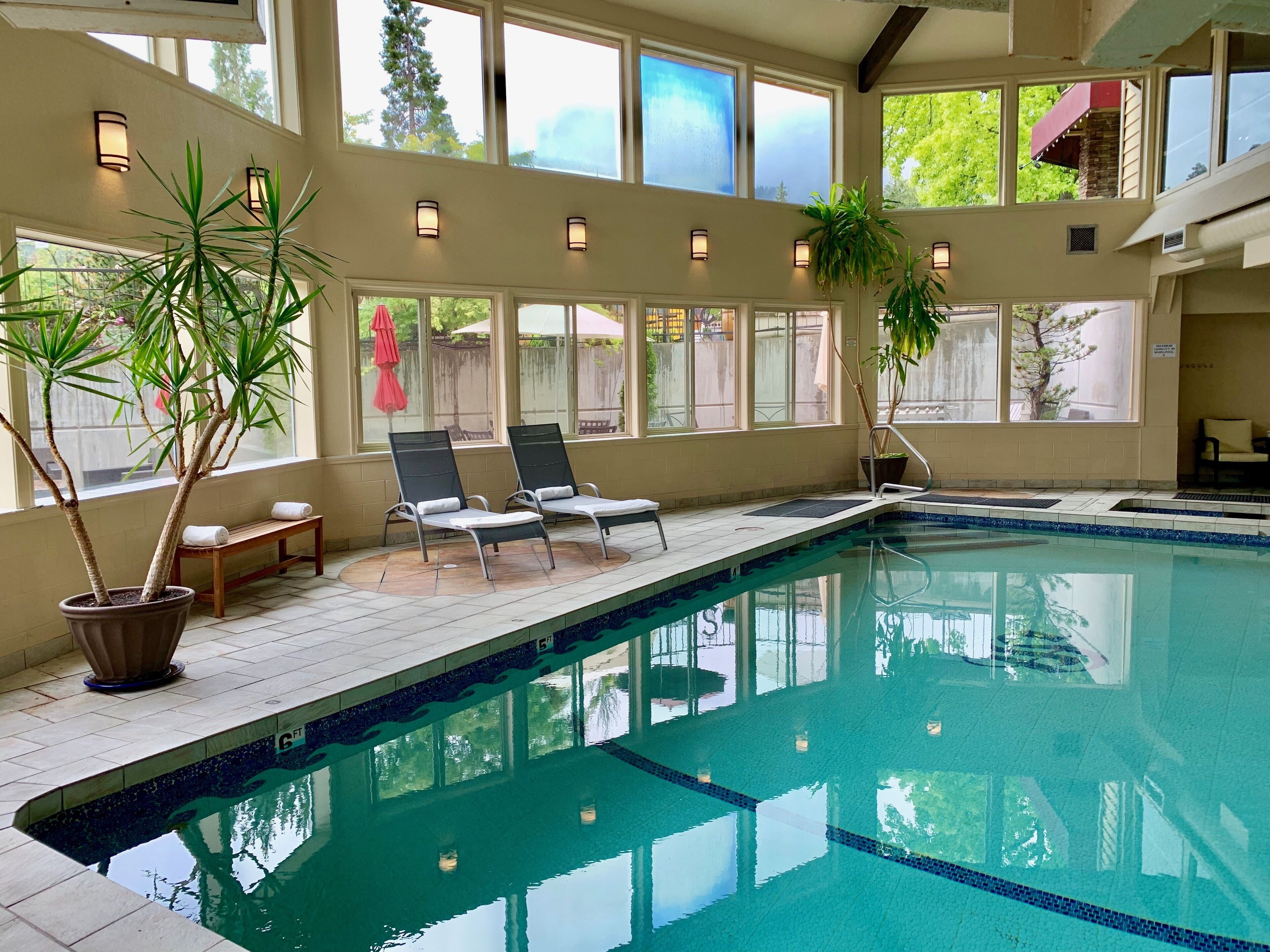 indoor pool, open 6 am to midnight, pool umbrellas, pool loungers