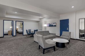 Room, Multiple Beds | Living area | 50-inch LED TV with cable channels, streaming services