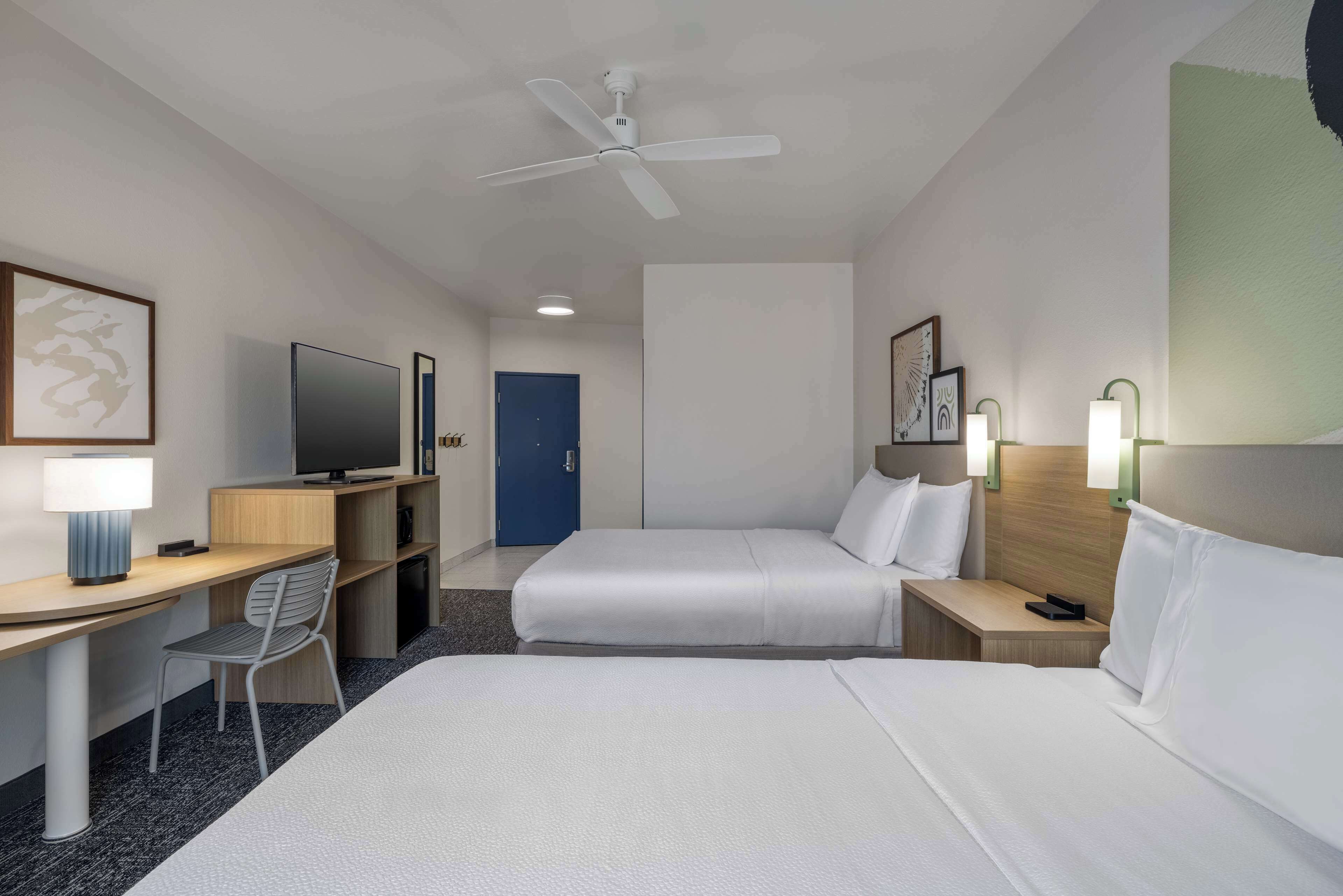 desk, laptop workspace, blackout curtains, iron/ironing board