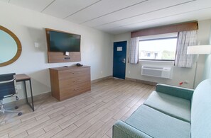 Deluxe Suite, Multiple Beds, Non Smoking, Pool View | Living area | 45-inch LCD TV with cable channels - Seashire Inn & Suites (Virginia Beach)