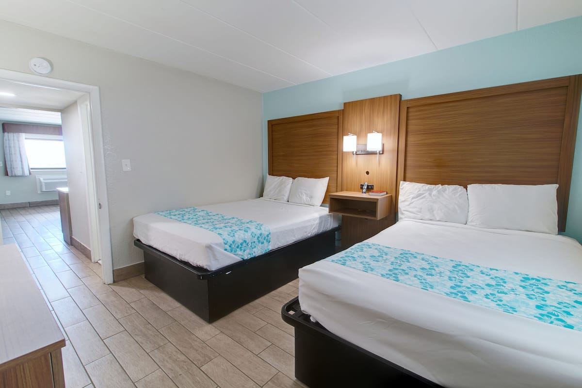 Deluxe Suite, Multiple Beds, Non Smoking, Pool View | Laptop workspace, iron/ironing board, free WiFi, bed sheets