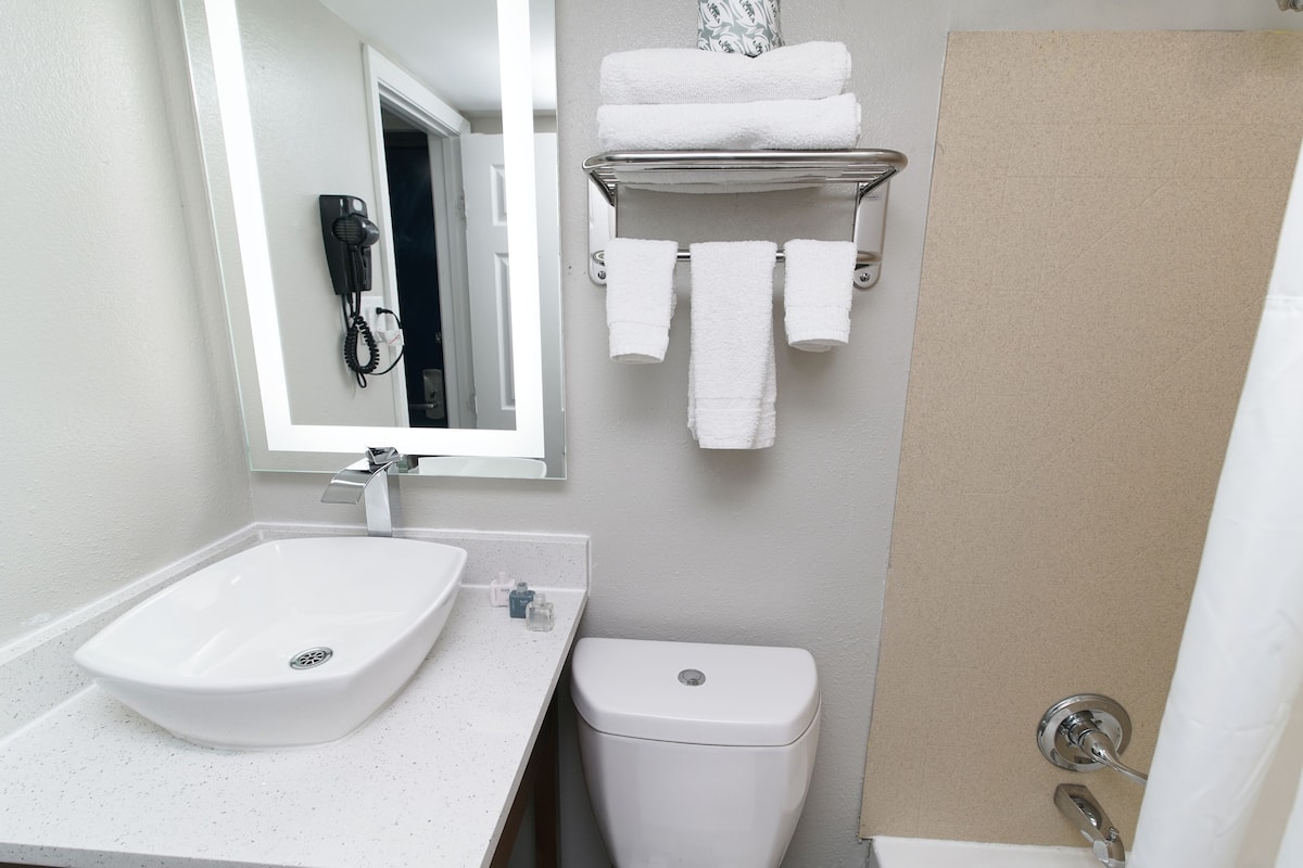 Combined shower/tub, hair dryer, towels, soap