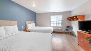 A hotel room with two beds, a TV, a desk, and a window. - Extended Stay America Select Suites - Birmingham - Bessemer (Bessemer)
