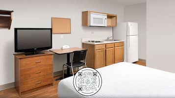 Desk, laptop workspace, blackout curtains, iron/ironing board