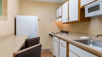 Full-size fridge, microwave, stovetop, freezer