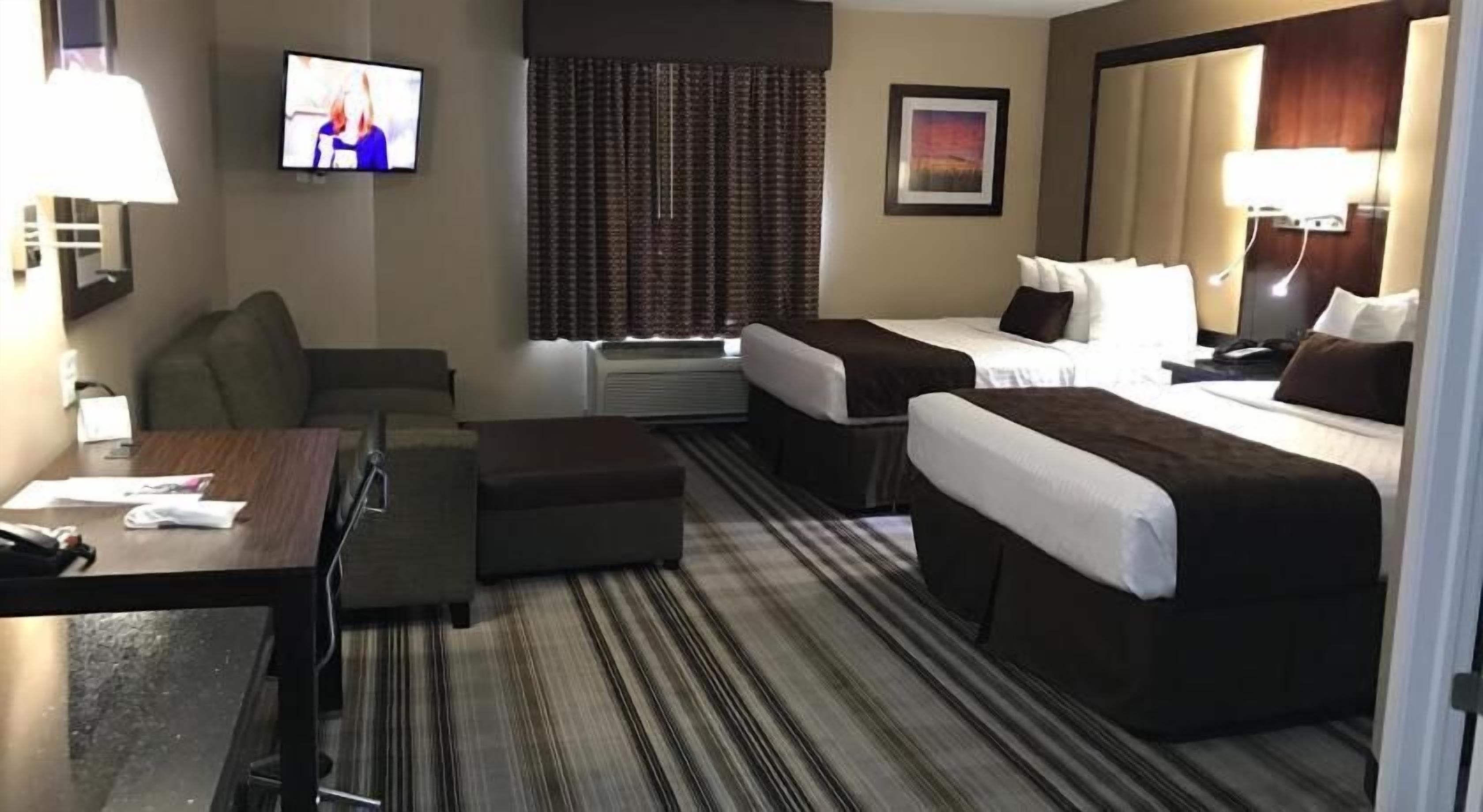 Hypo-allergenic bedding, pillow-top beds, desk, laptop workspace
