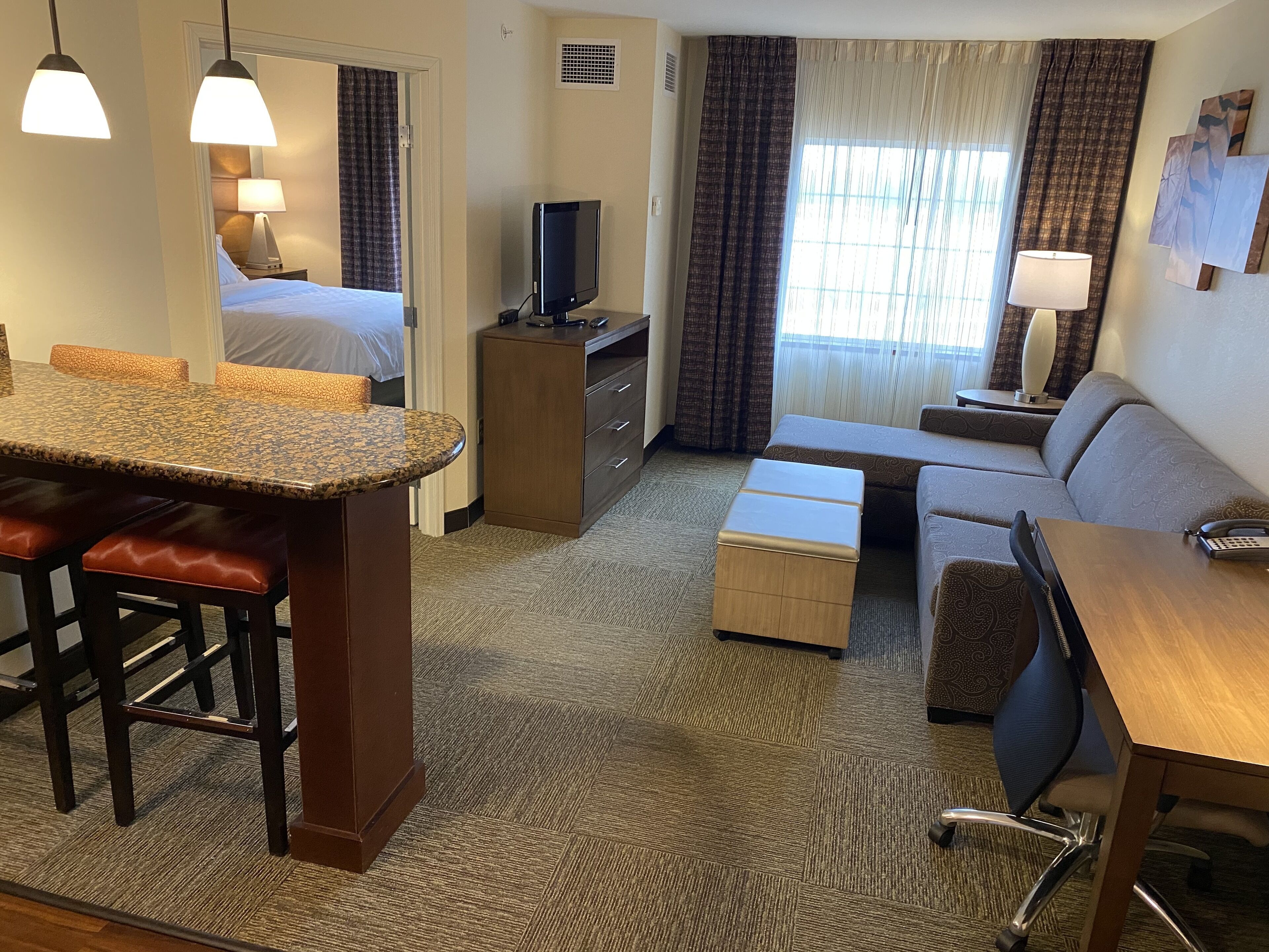 suite, 1 queen bed, kitchen, river view | living area | tv, dvd player