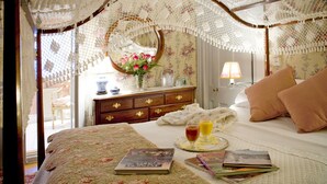 A neatly arranged bedroom with a bed, bedside table, and a dresser. - The Stockbridge Country Inn Closest B&B to Norman Rockwell Museum and Chesterwood (Stockbridge)