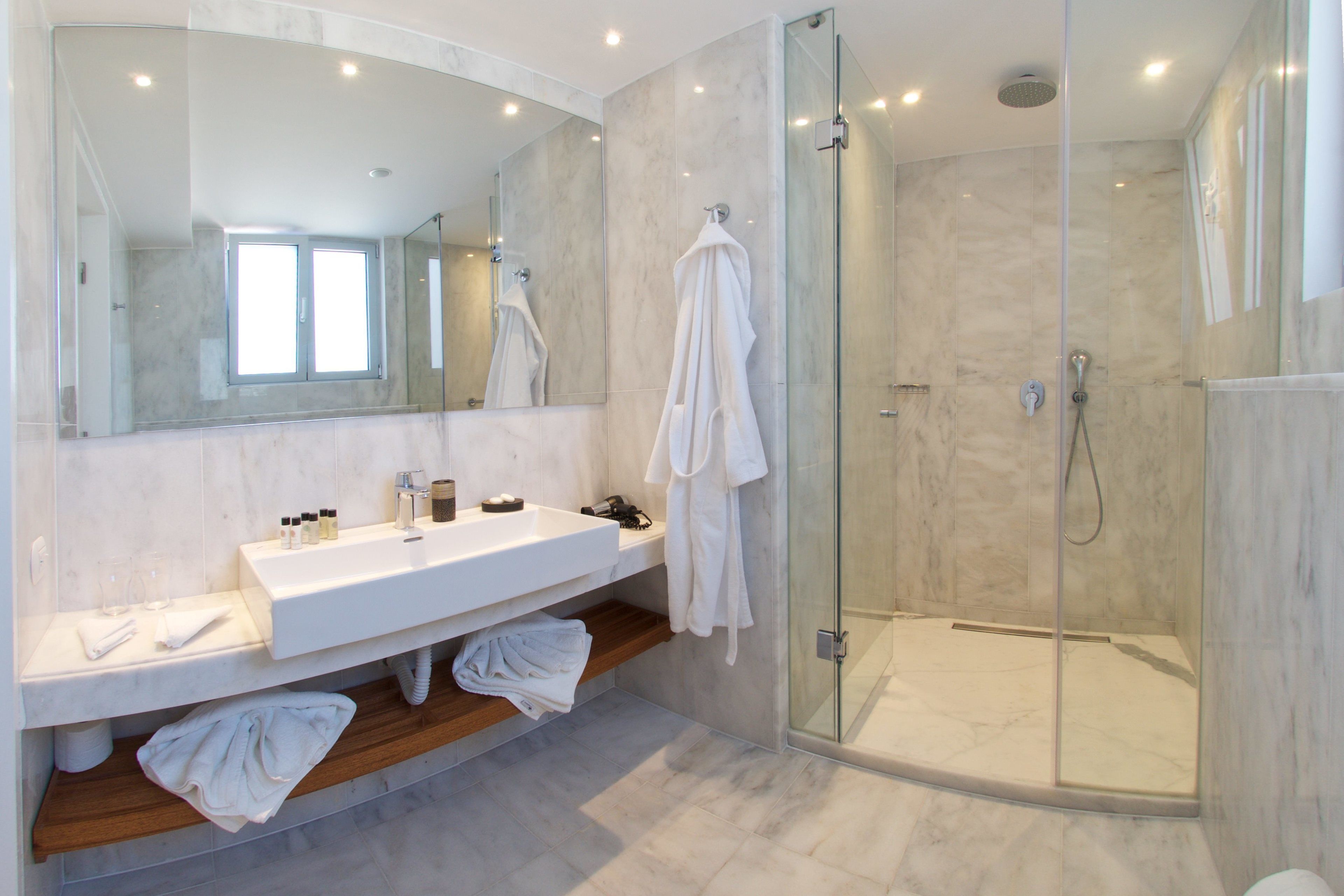 master suite with outdoor jetted tub and panoramic sea view | bathroom | shower, free toiletries, hair dryer, bathrobes