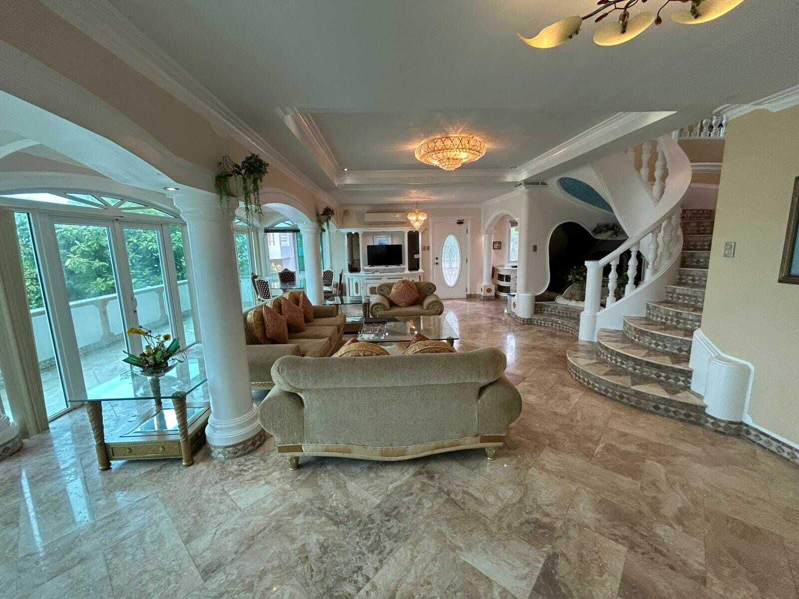 Royal Suite, 3 Bedrooms | Living area | 43-inch TV with cable channels