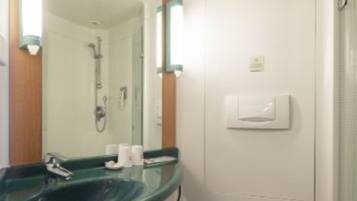 Shower, free toiletries, hair dryer, slippers