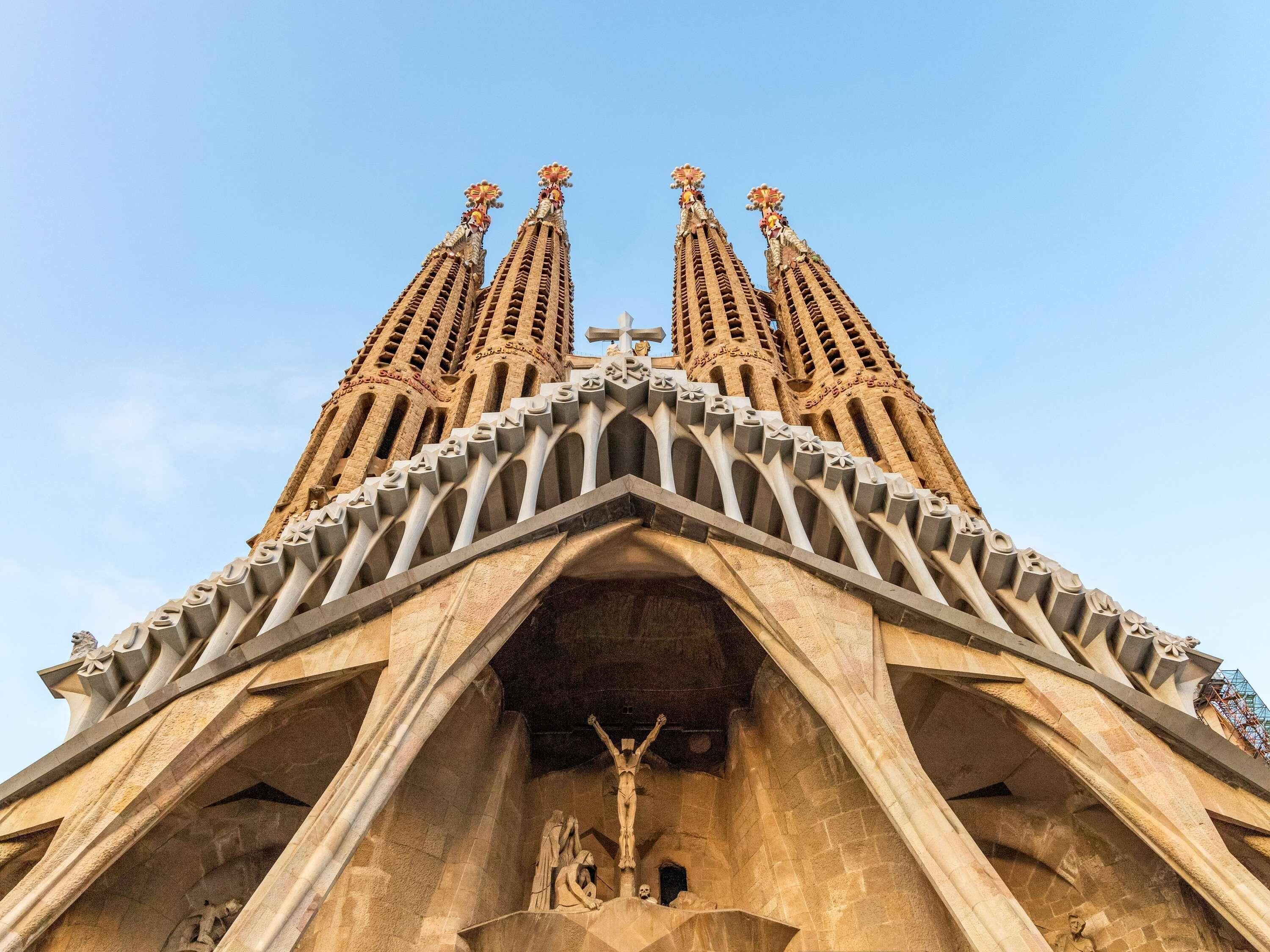 A building with a distinctive architectural style, featuring a central spire and multiple smaller spires.