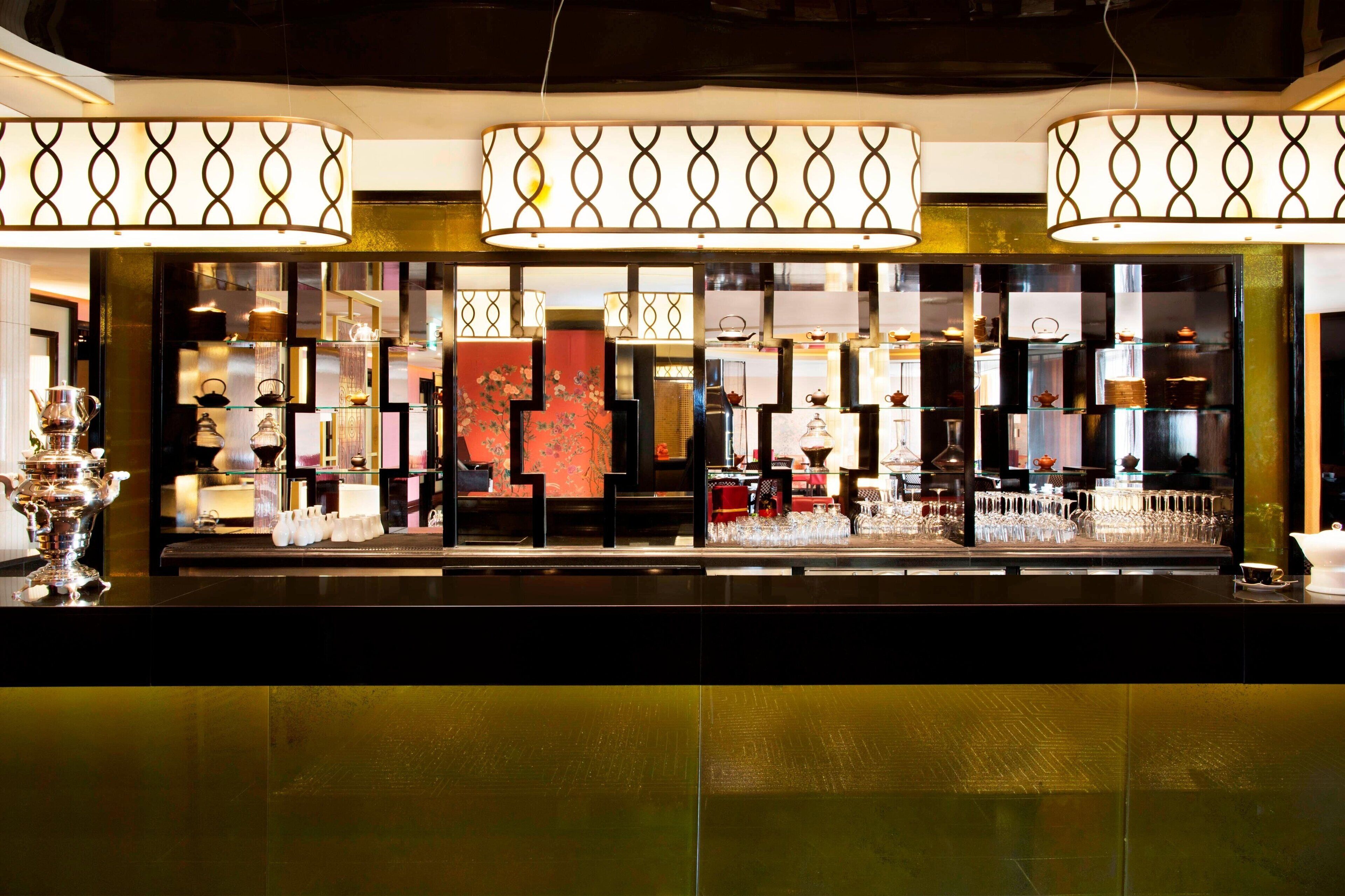 A well-lit display of glassware and decorative items in a store setting.