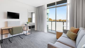 Executive One Bedroom Apartment | Living area | 32-inch LCD TV with digital channels, TV, Netflix
