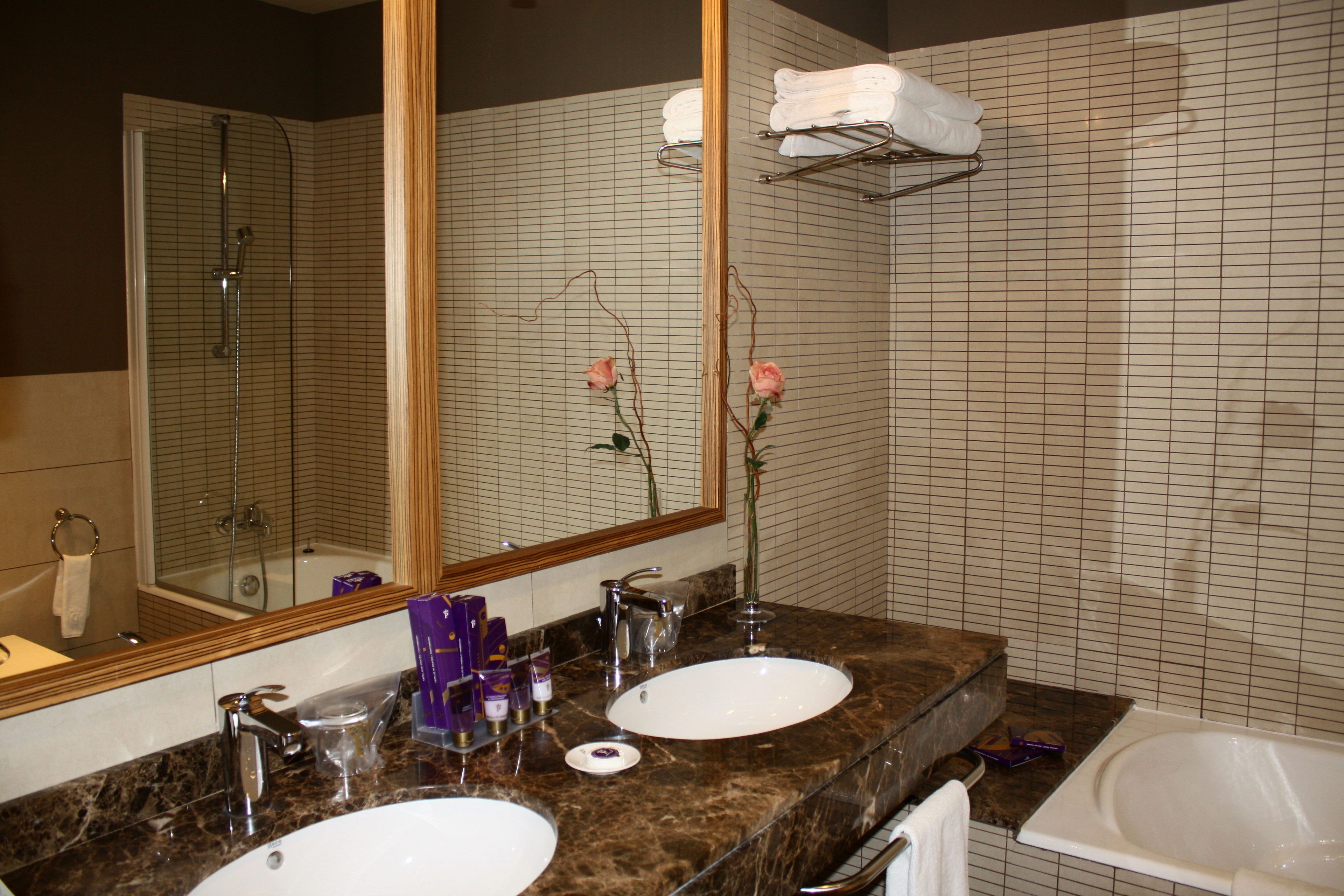 bathtub, hair dryer, bidet, towels