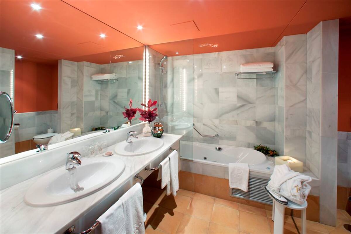 junior suite, 1 queen bed | bathroom | designer toiletries, hair dryer, bidet, towels