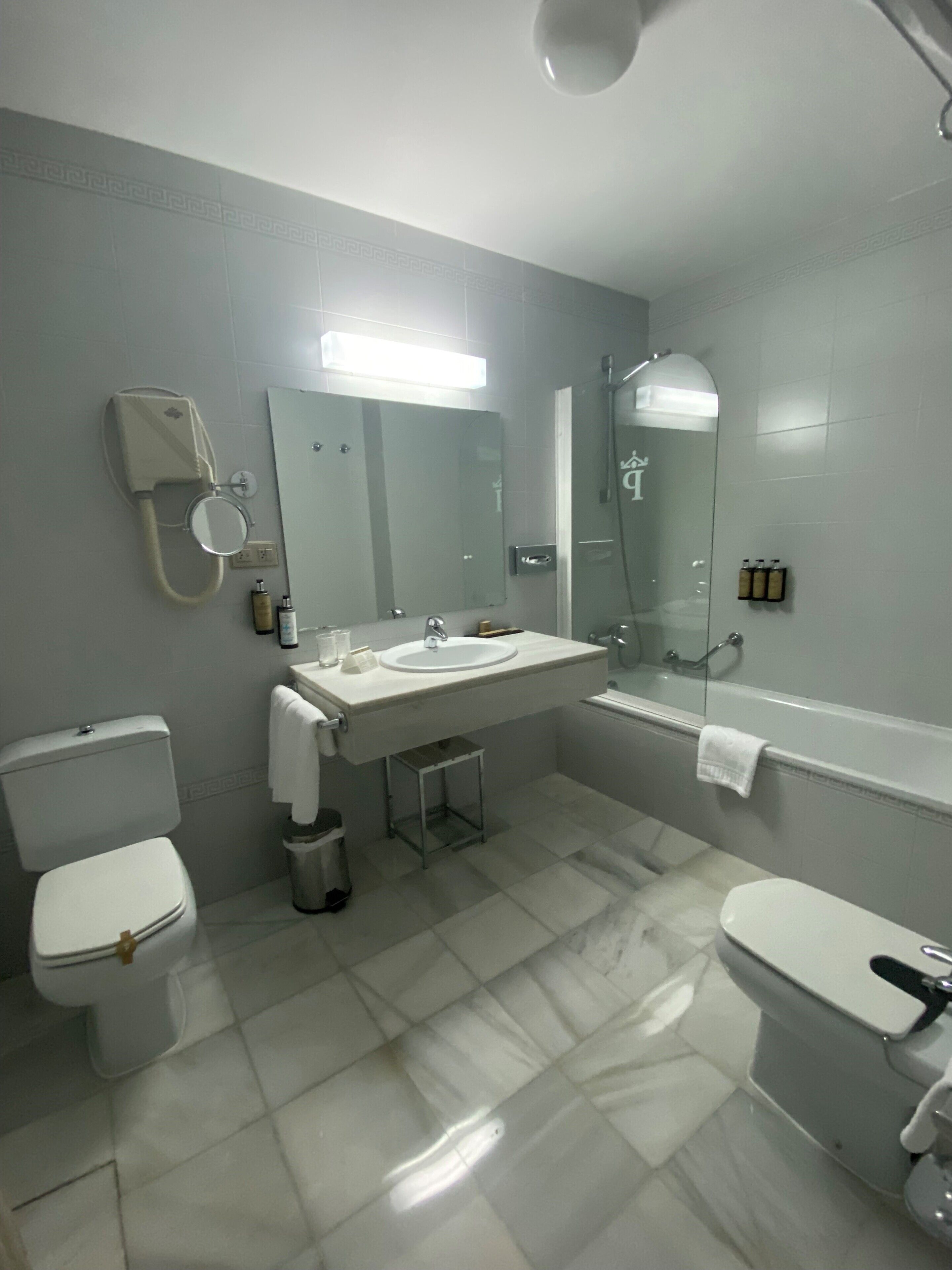 superior double room | bathroom | bathtub, free toiletries, hair dryer, towels