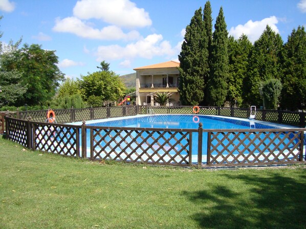Outdoor pool, open noon to 9:00 PM, pool umbrellas, pool loungers