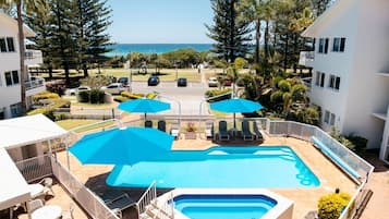 Outdoor pool, pool umbrellas, pool loungers