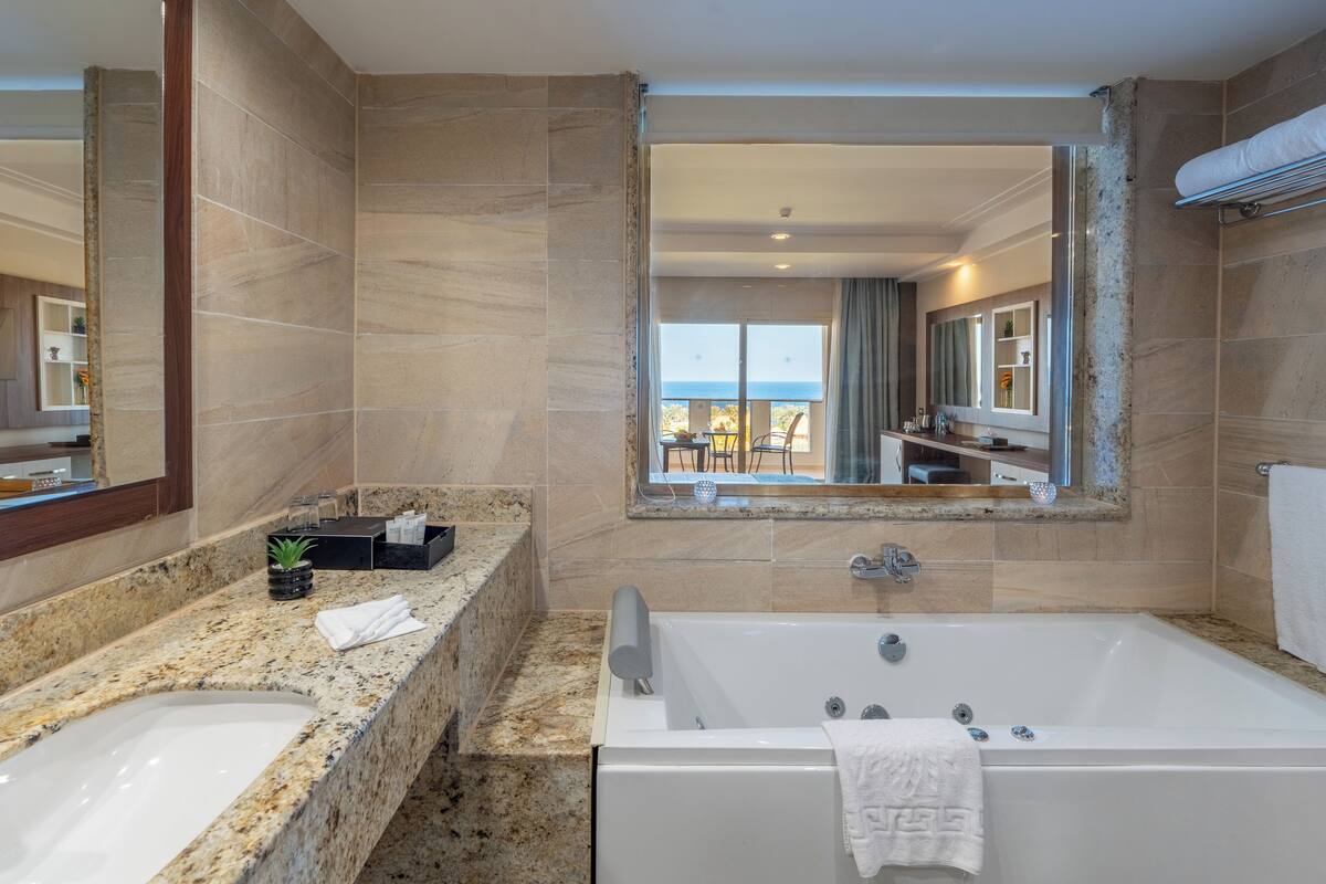 grand club room sea view | bathroom | shower, free toiletries, hair dryer, towels