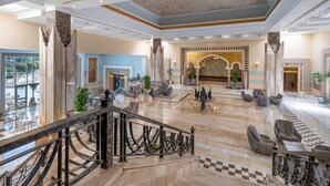 A spacious lobby with a marble floor, seating areas, and a staircase with a black railing. - SRNTY Sea Reef - Ex Serenity Alpha Beach (Makadi Bay)