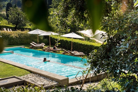 Seasonal outdoor pool, open 9:00 AM to 6:30 PM, pool umbrellas