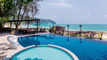 2 outdoor pools, open 6 AM to 7 PM, pool umbrellas, pool loungers